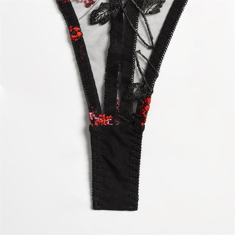 Black sheer lingerie set composes of a sexy short corset and tanga panties